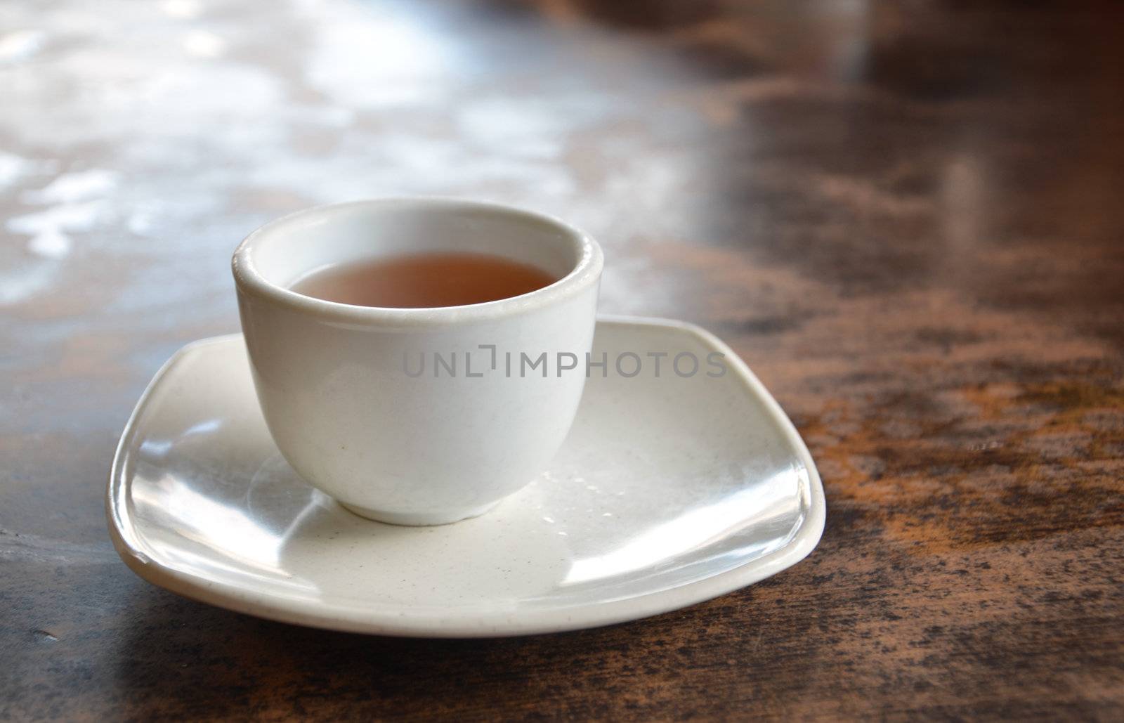 a cup of hot tea on table