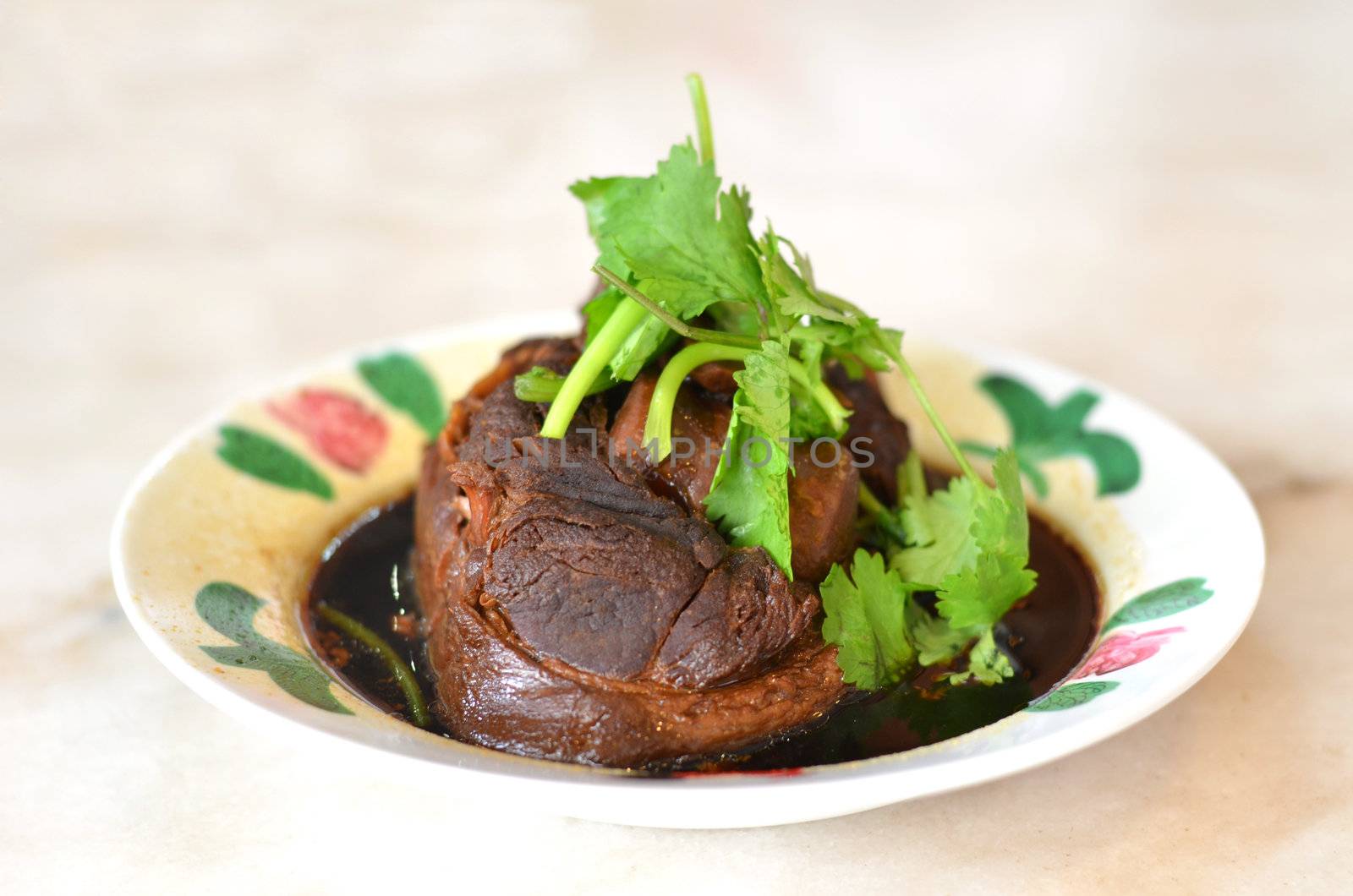 Pork shank cooked  in soya sauce, with preserved vegetable,  famous chinese dish 