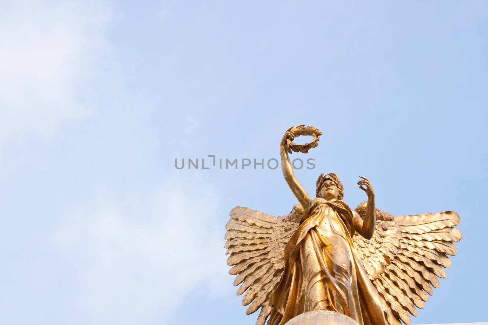 Goddess statue in the sky on a clear sky, beautiful clouds.