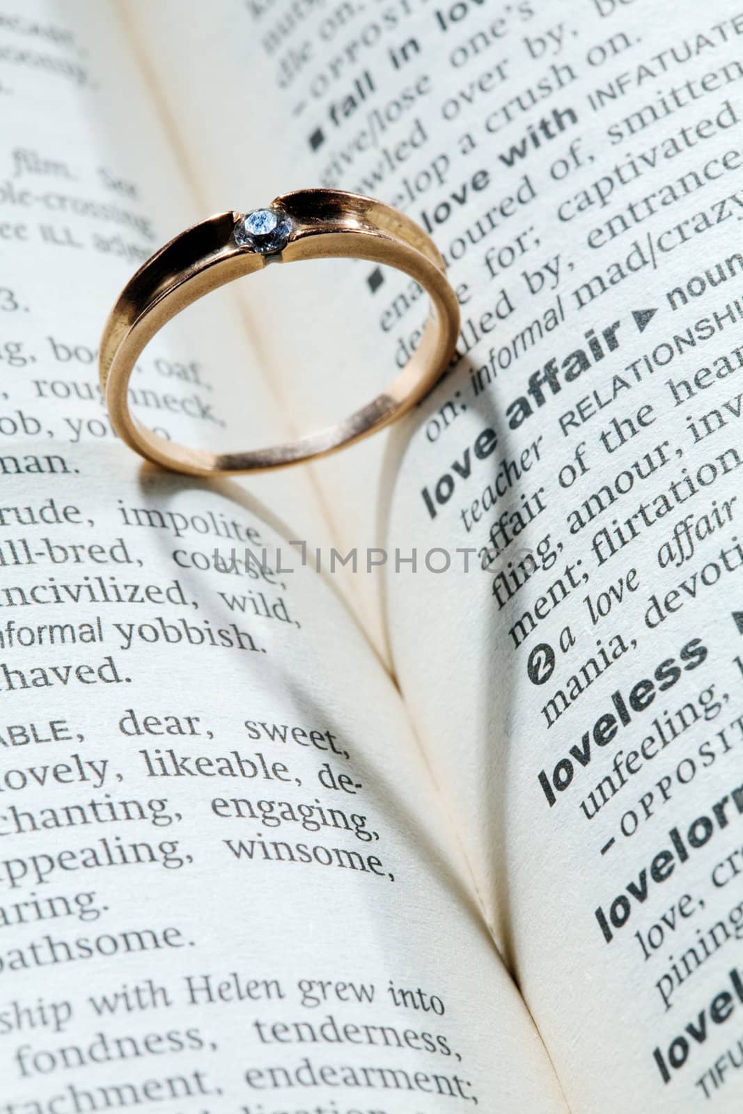 An image of a golden ring with shade in the form of heart