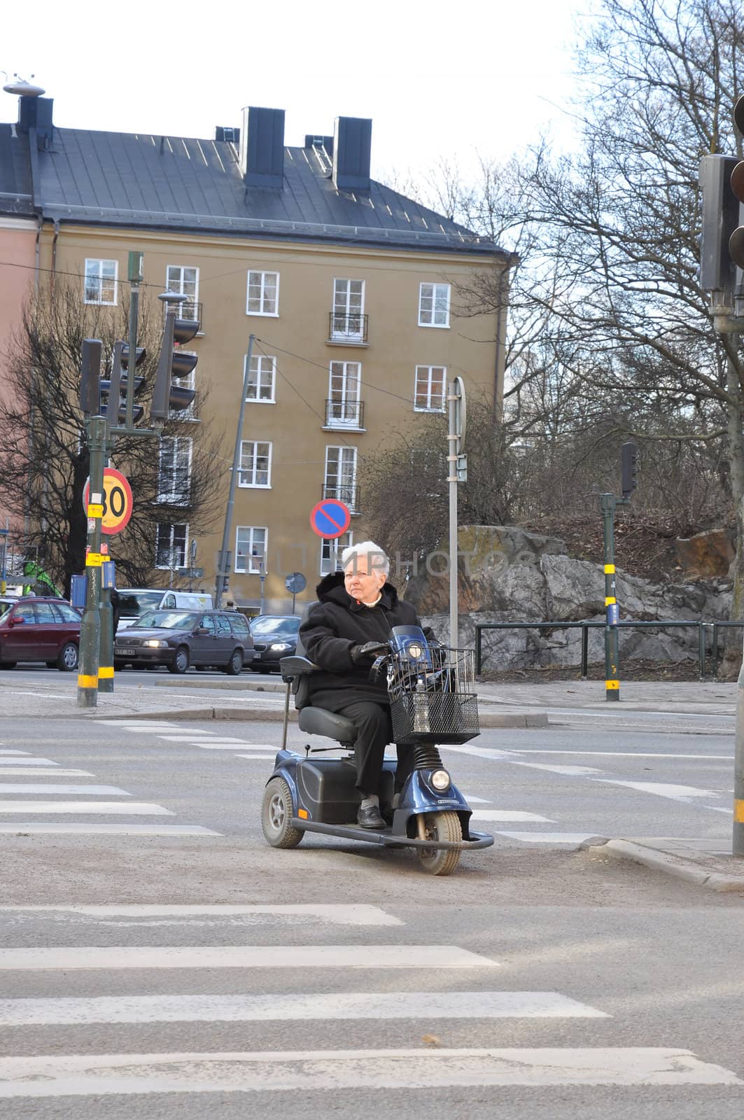 STOCKHOLM, SWEDEN Mars 2, 2012. Not everyone can use there legs when they want to take a nice walk in the spring. An electric wheel chair makes it easier.