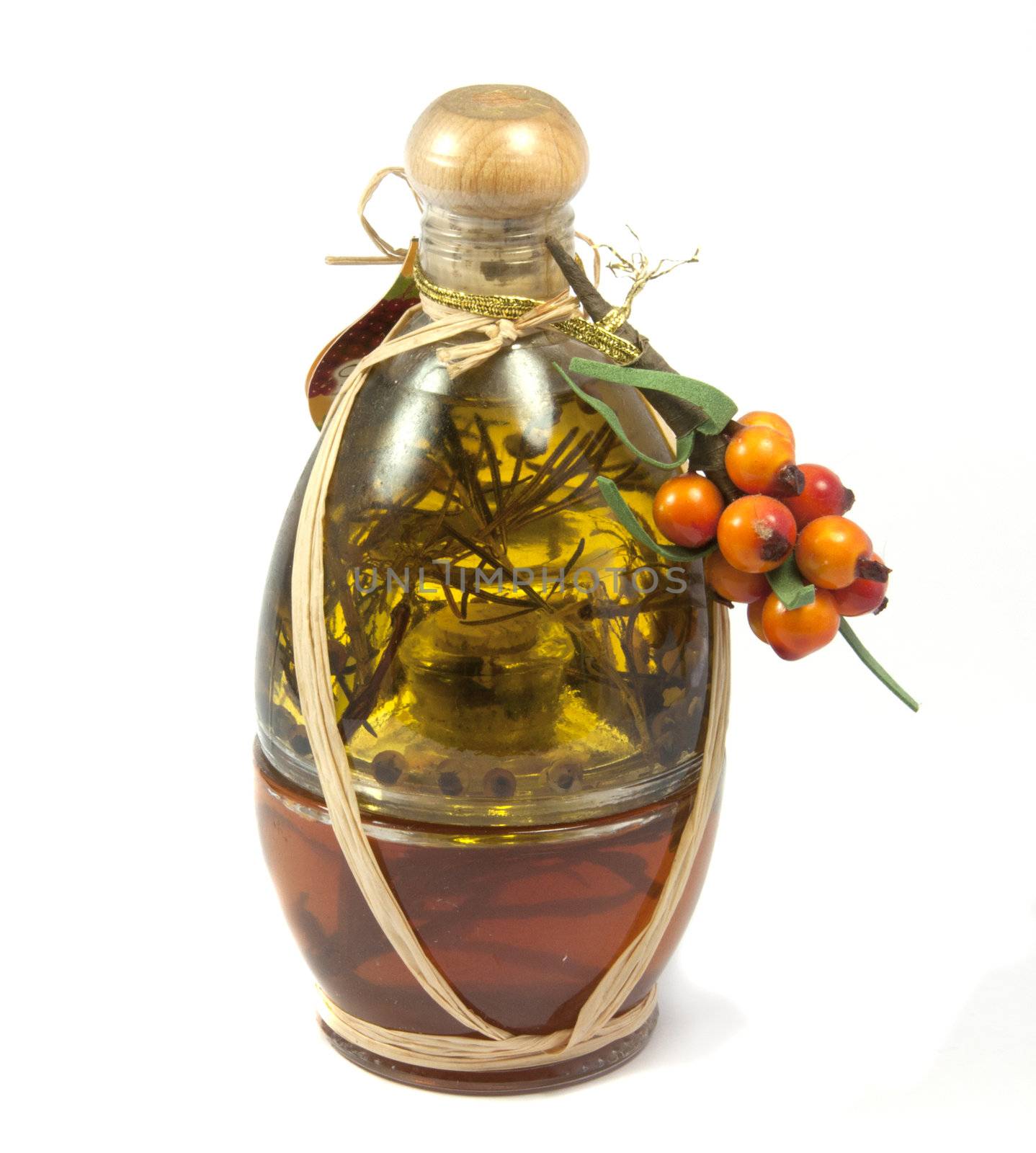 herb vinegar with orange decoration grapes