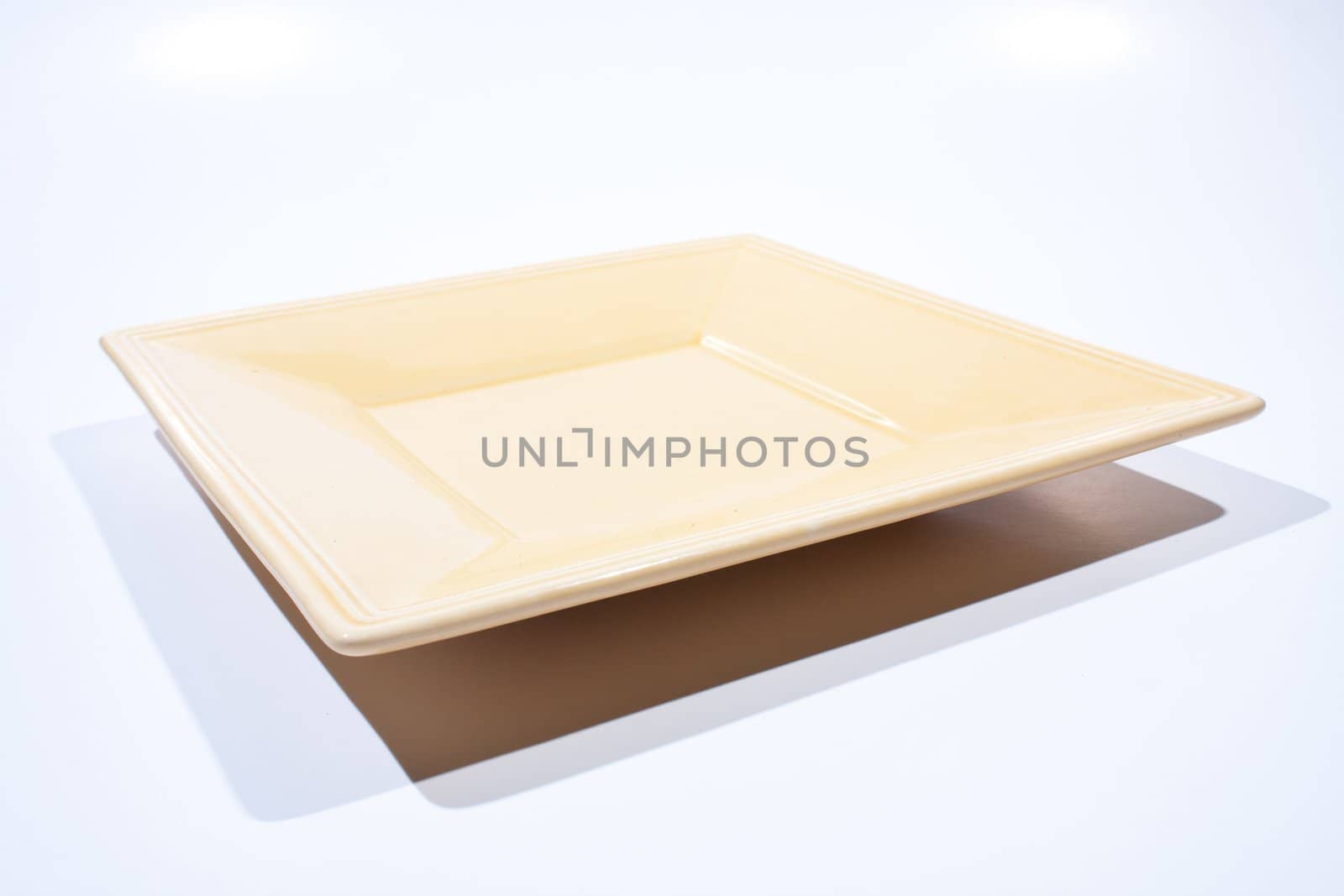 Rectangular plate shaped orange light on a white background.