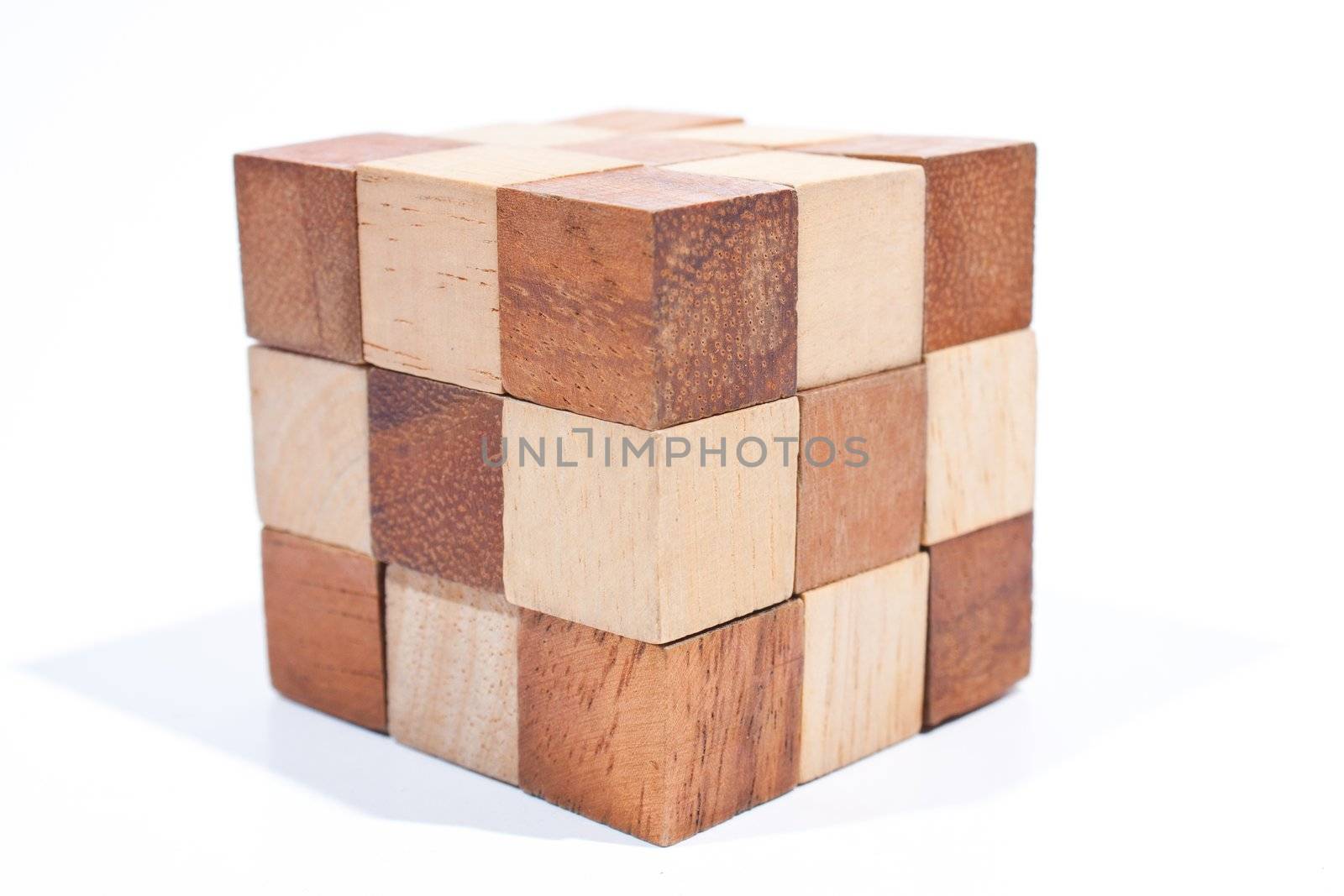 Wooden toy cube. Placed on a white background, then shoot.