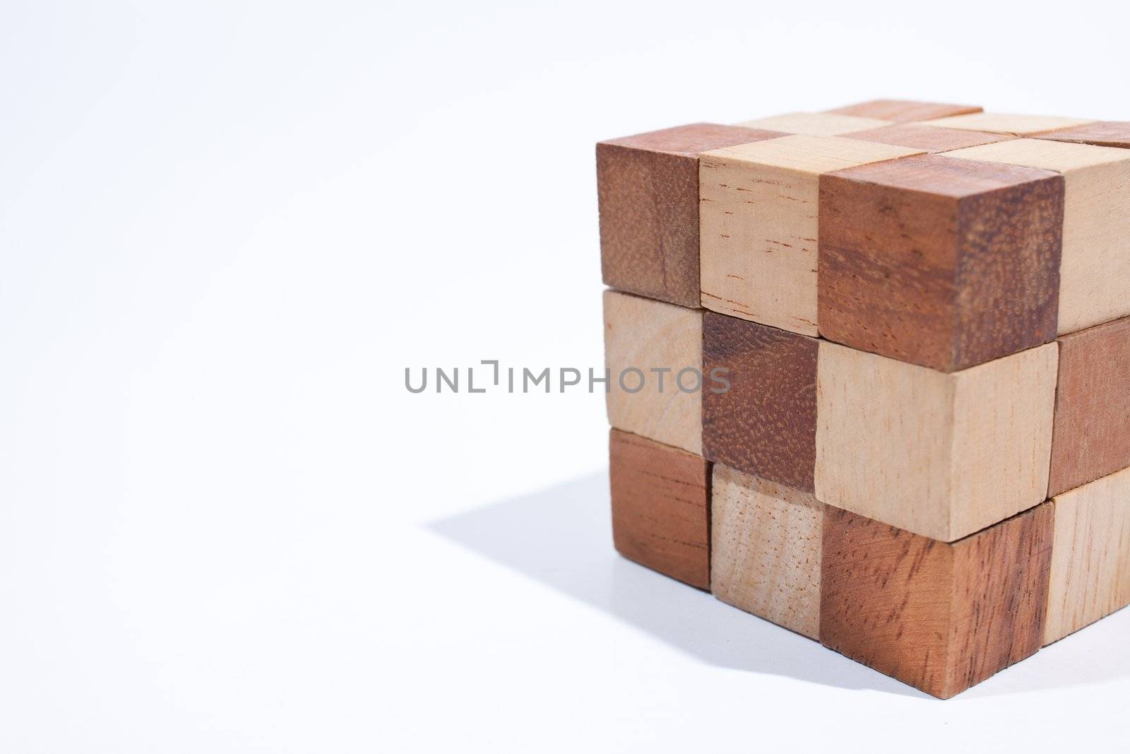 Wooden toy cube. Placed on a white background, then shoot.