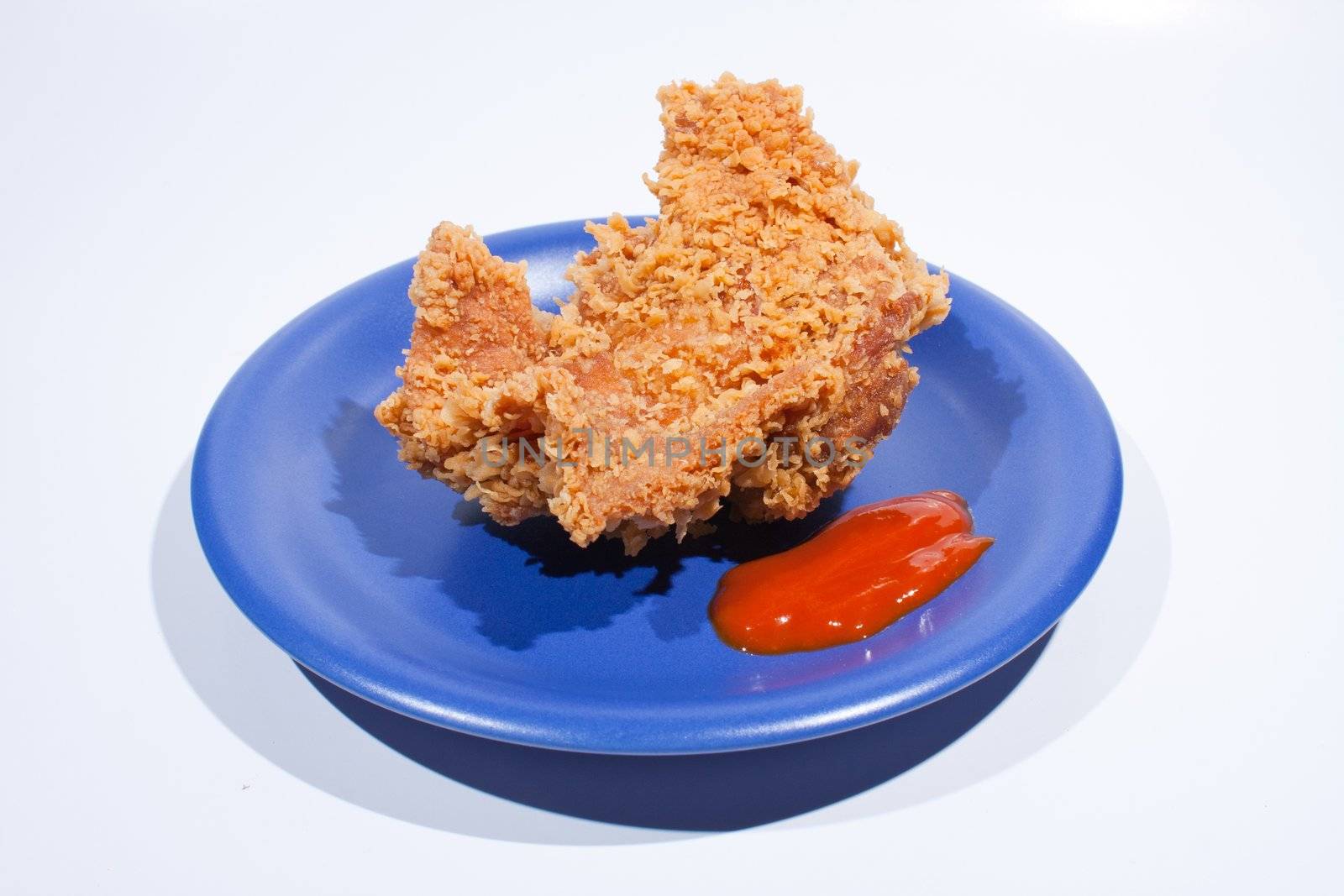 Fried chicken and sauce dish dark blue. by a454