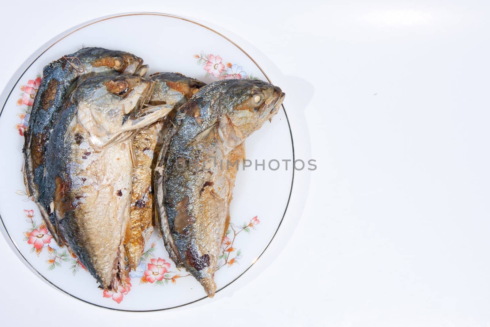 Division Two fish fry held on the plate insert. On a white background.