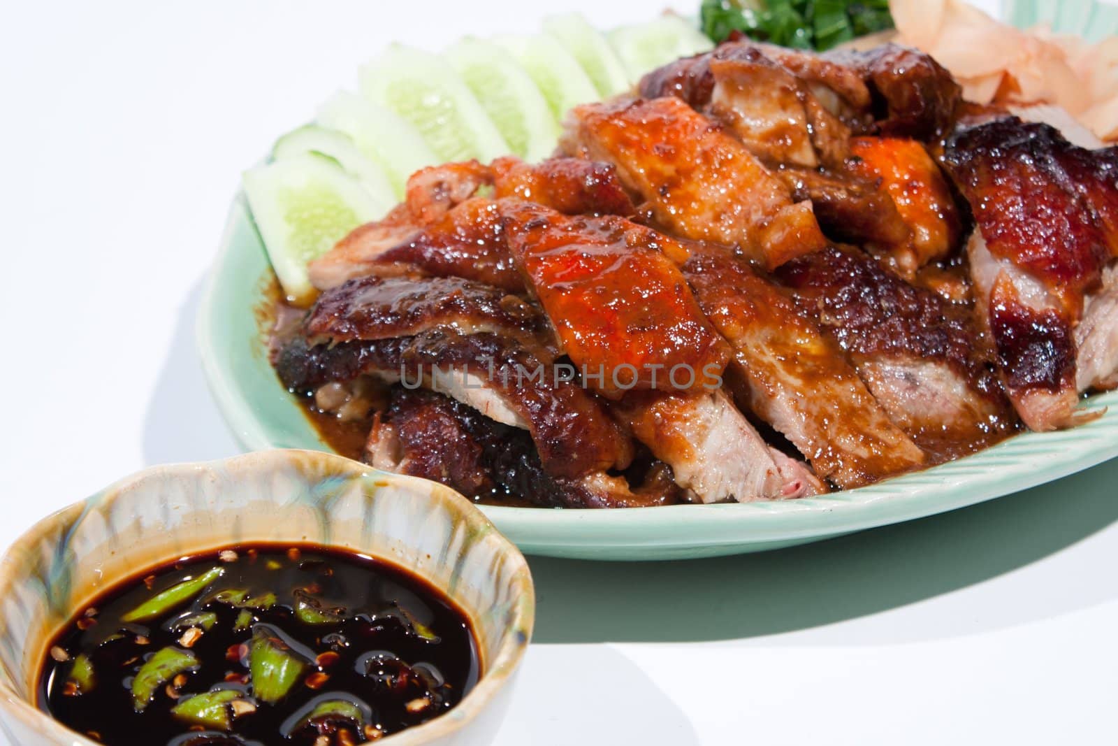 Roast Duck Thai food. Arrange on a plate to be palatable Placed on a white background.