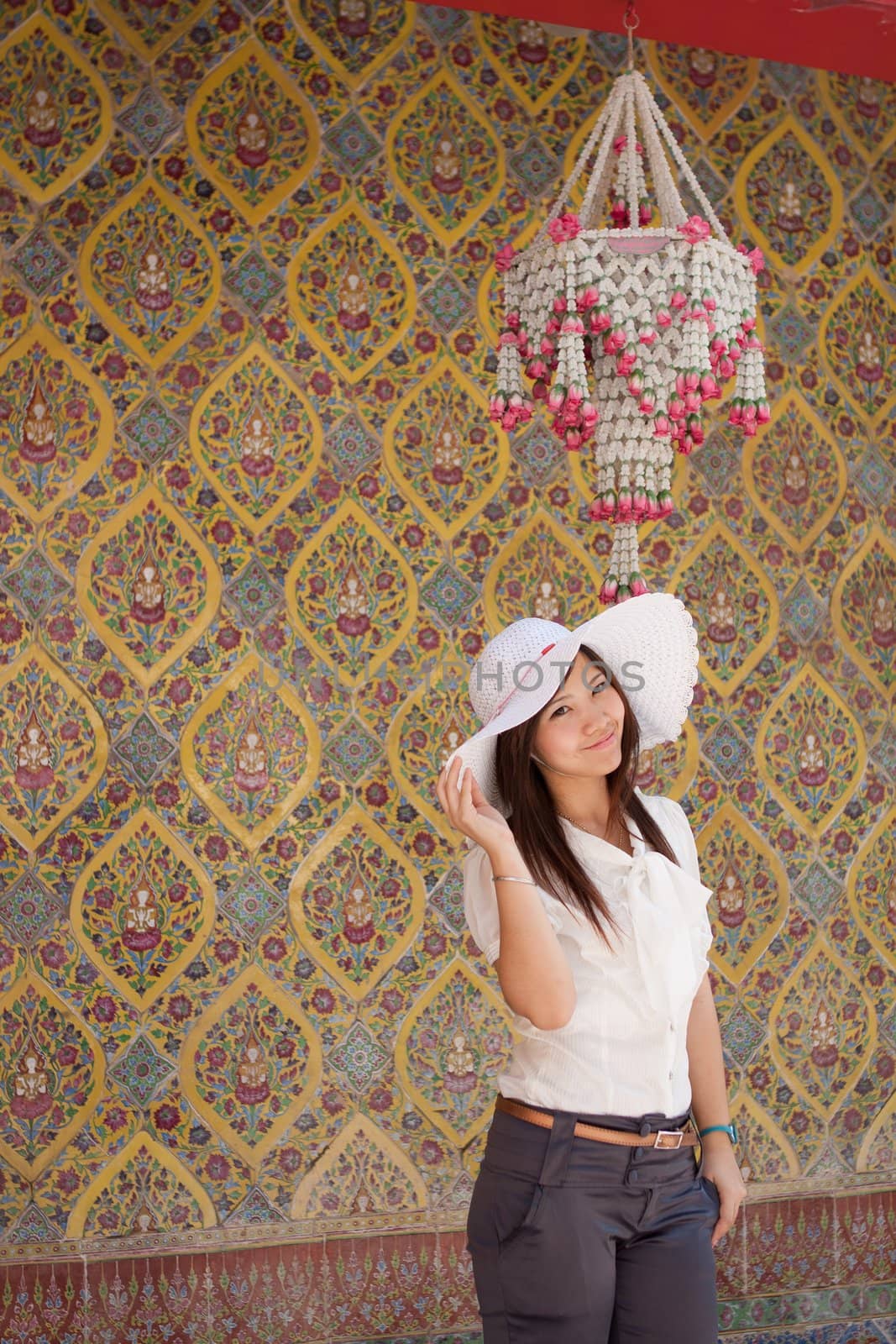 smiling young thai girl a on the thai paint background