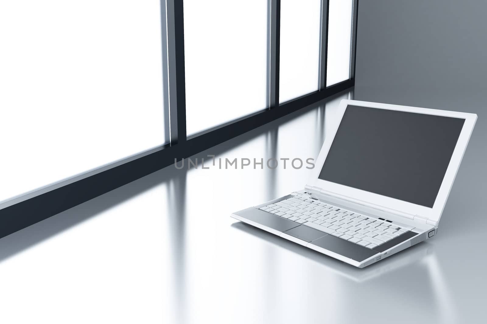 laptop on a smooth surface and light from a window