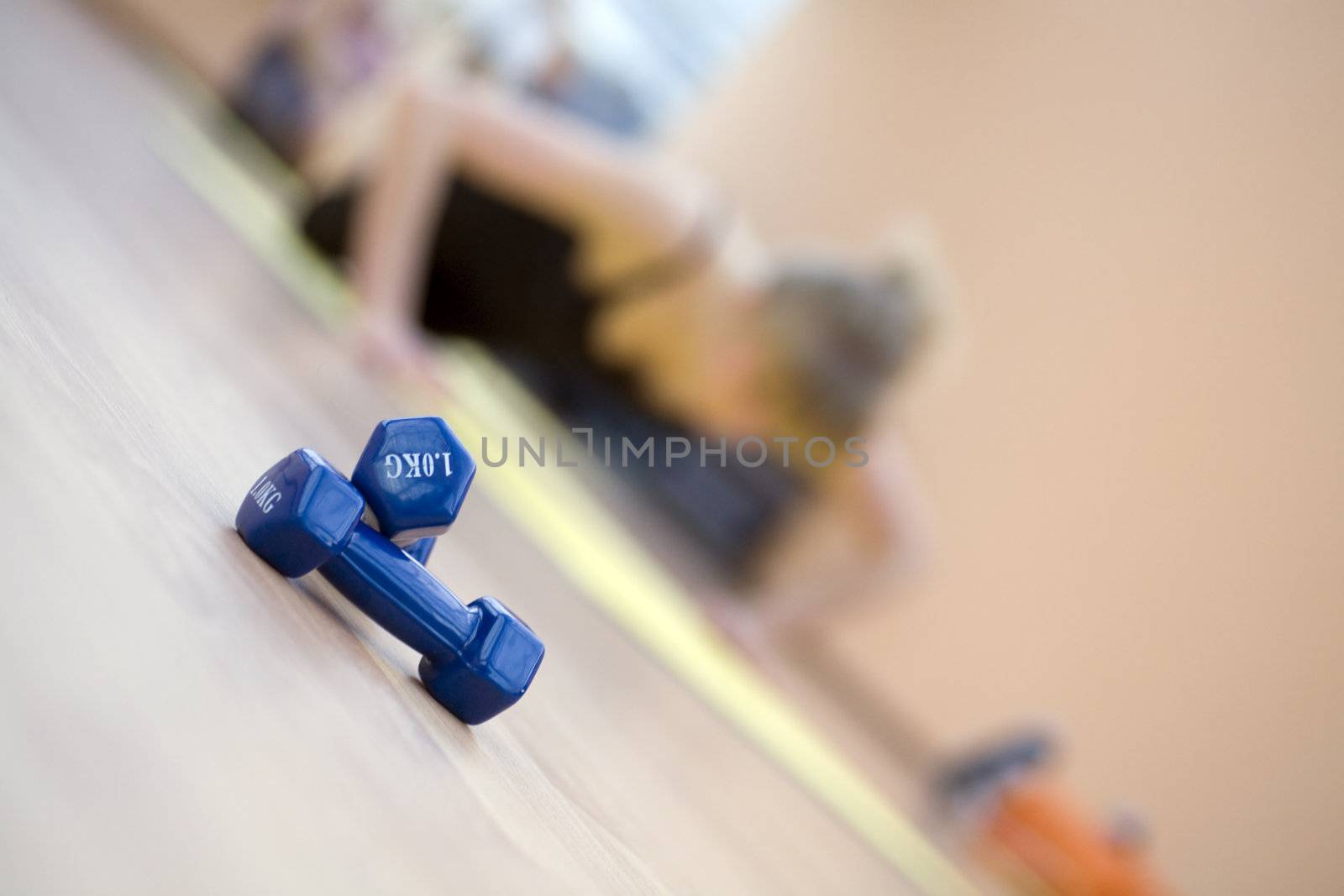 blue dumbbells in a modern hall for sports trainings