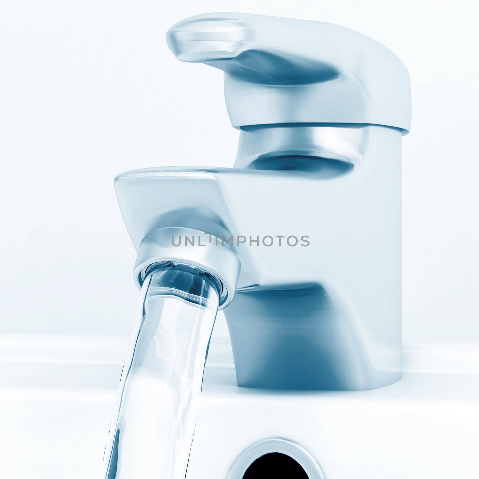 ceramic white washing sink with a modern faucet and flowing water