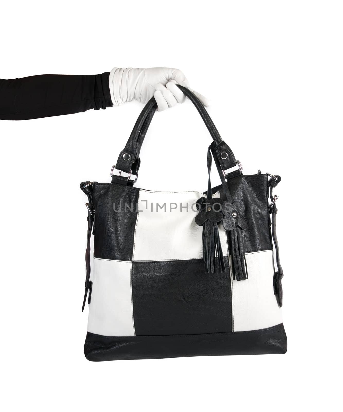 Black and white women bag at hand isolated on white background