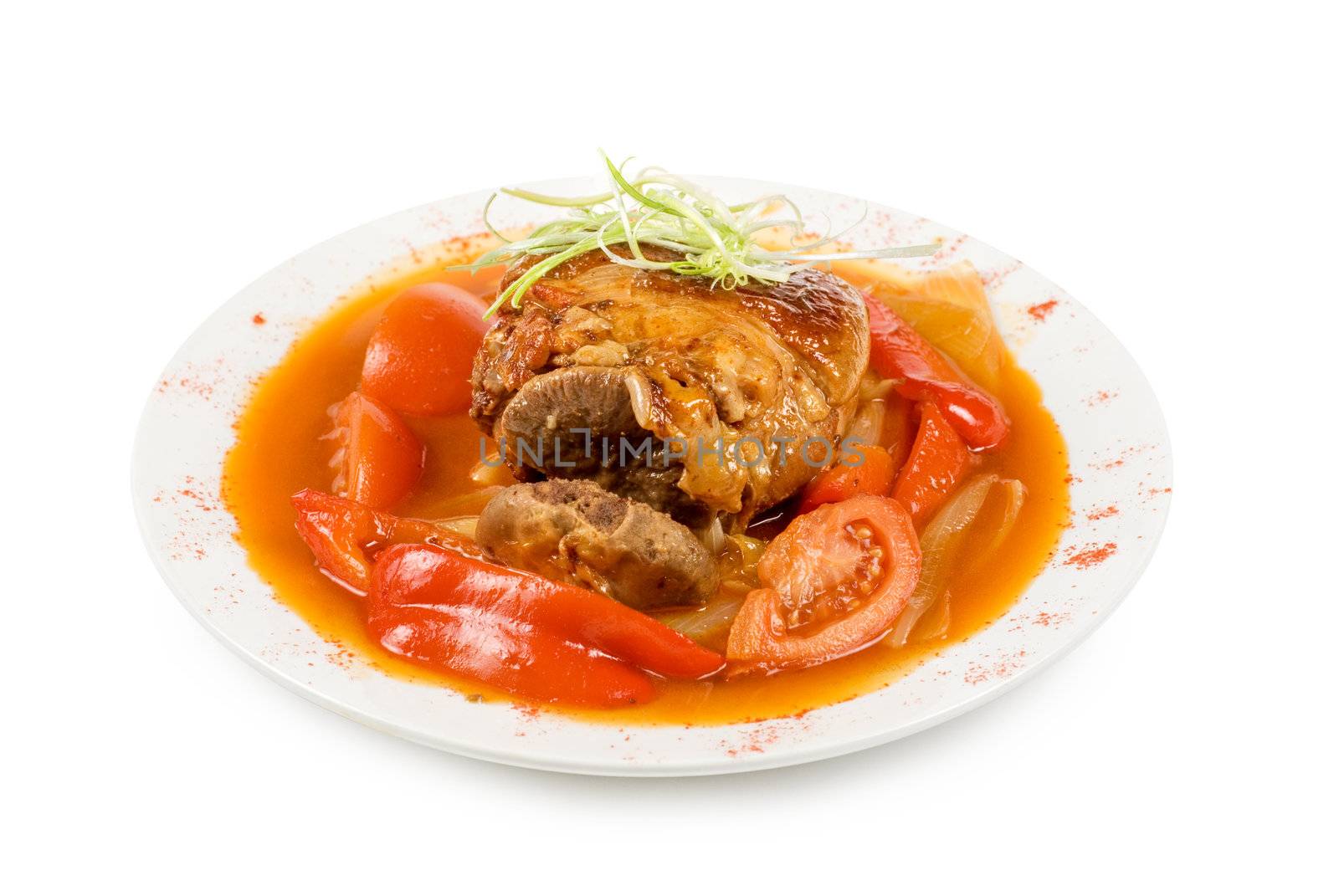 knuckle of veal with vegetables isolated on a white