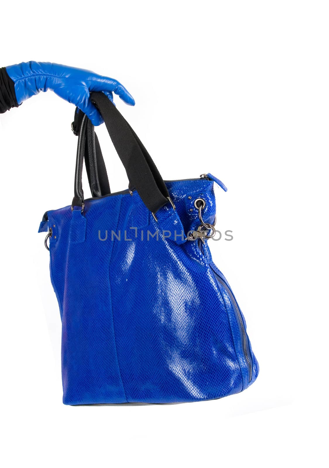 Blue women bag at hand isolated on white background