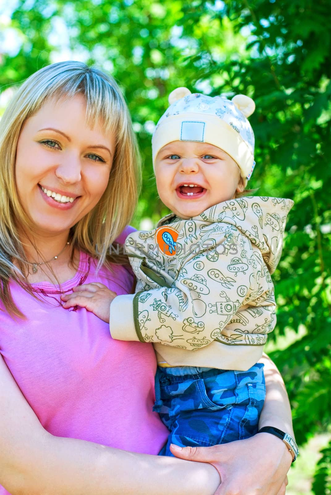 happy mum and her boy outdoor portrait