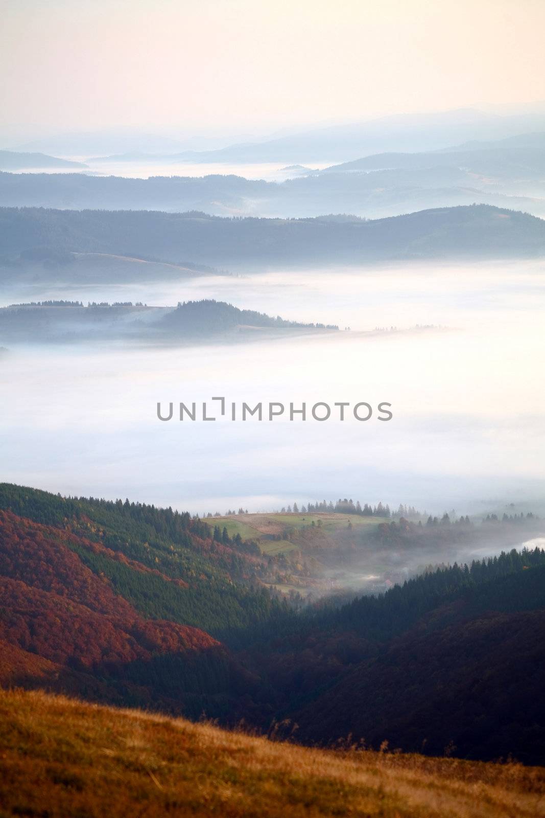 An image of mist in the dark mountains
