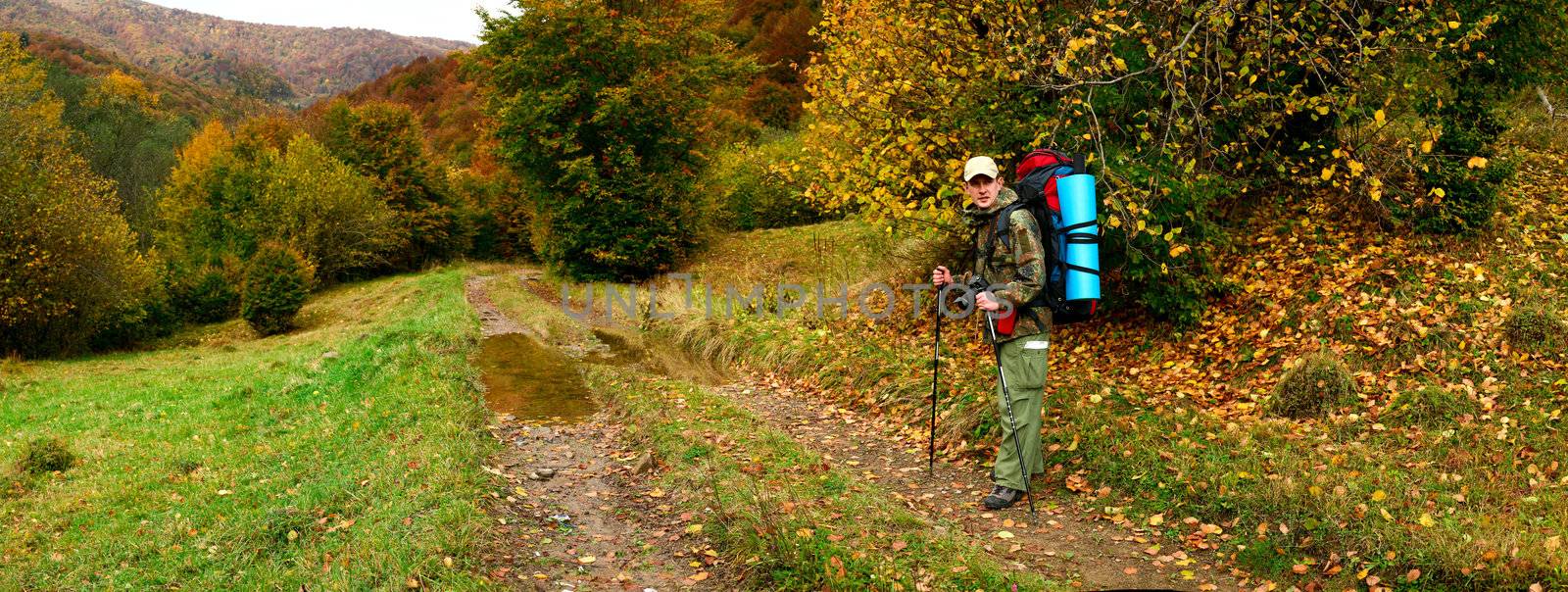 An image of a tourist in the mountains