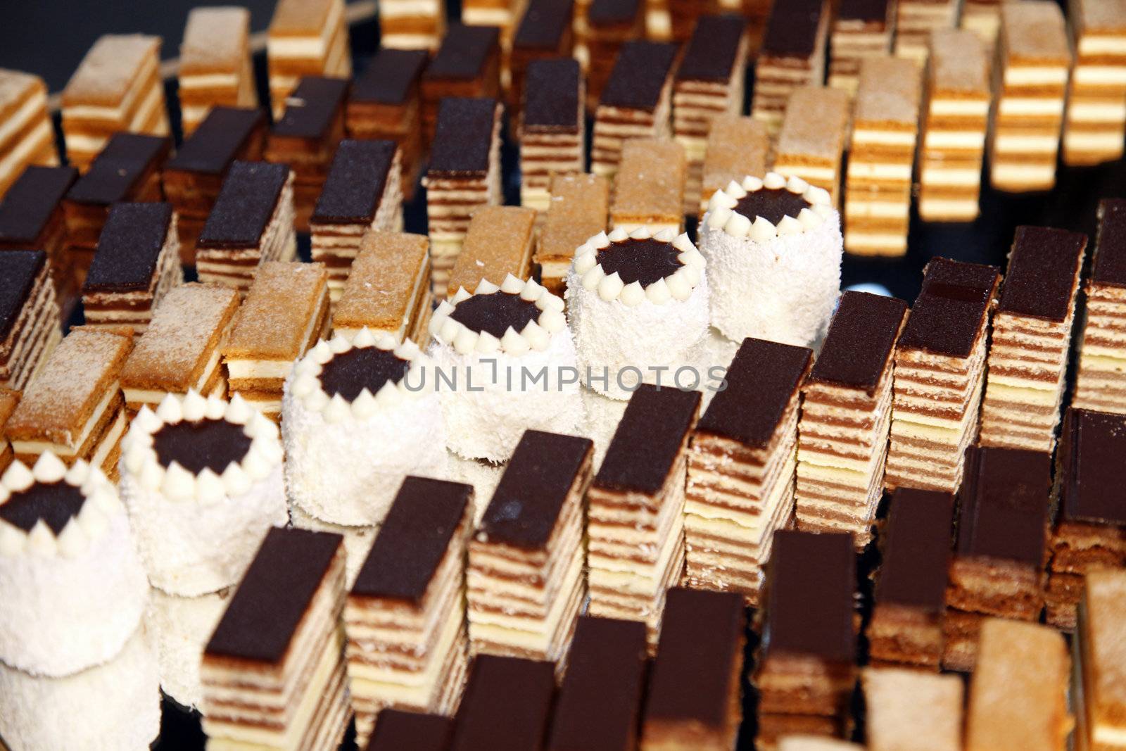 Colorful desserts and pastry served on a wedding party