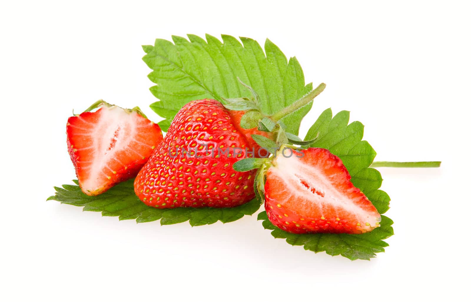 Red sliced strawberry fruits with green leaves isolated on white background 