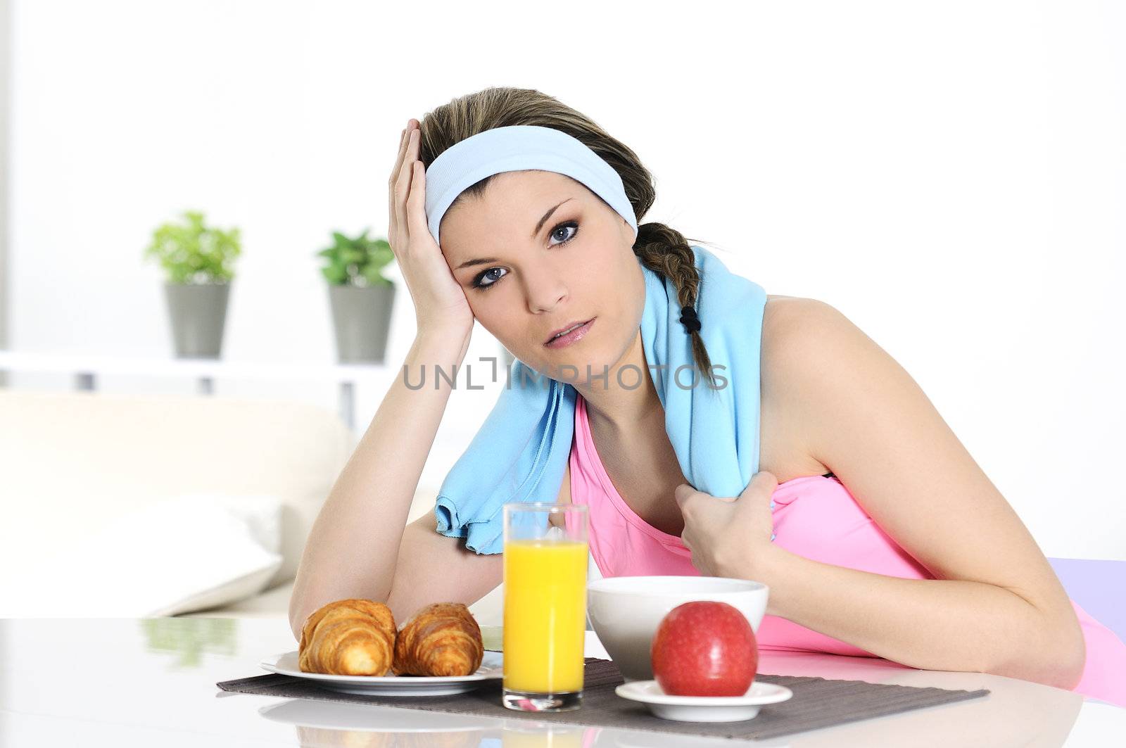 young athletic woman having breakfast