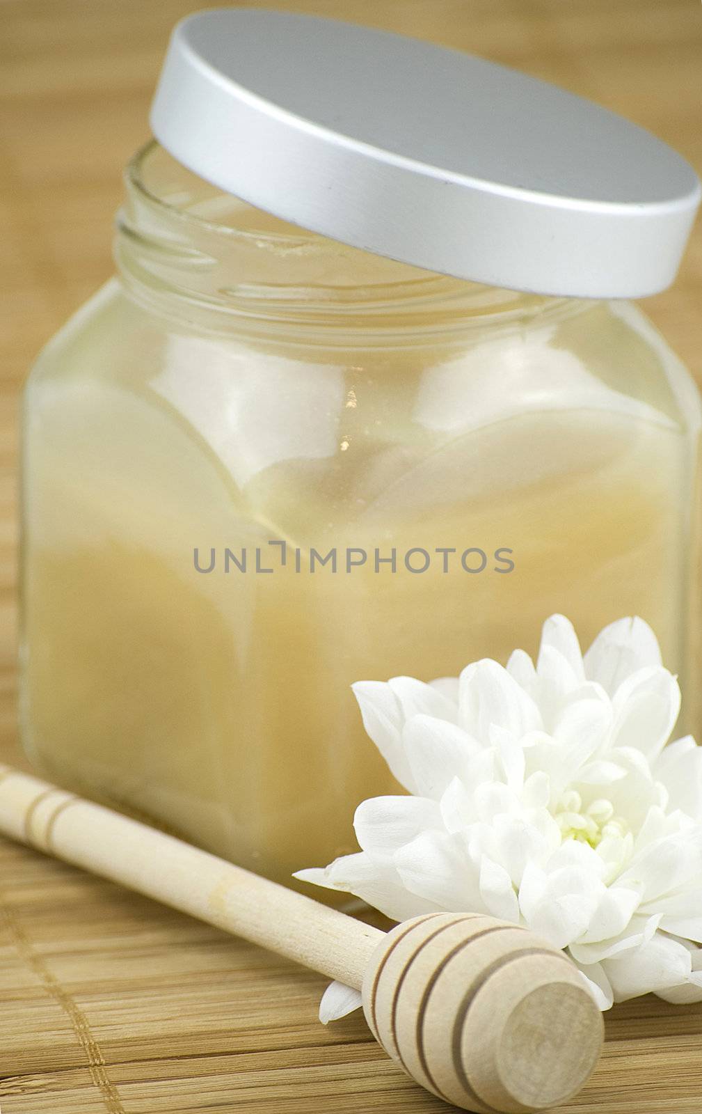 relaxing aroma of almond coconut vanilla milk and honey bath foam over wooden mat