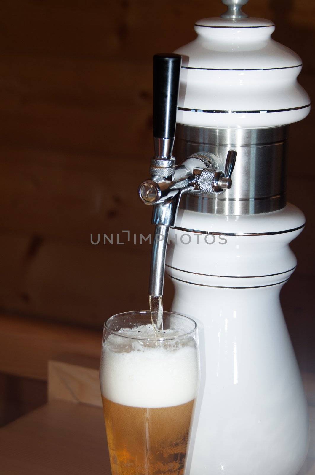 closeup of fresh beer pouring from a tap