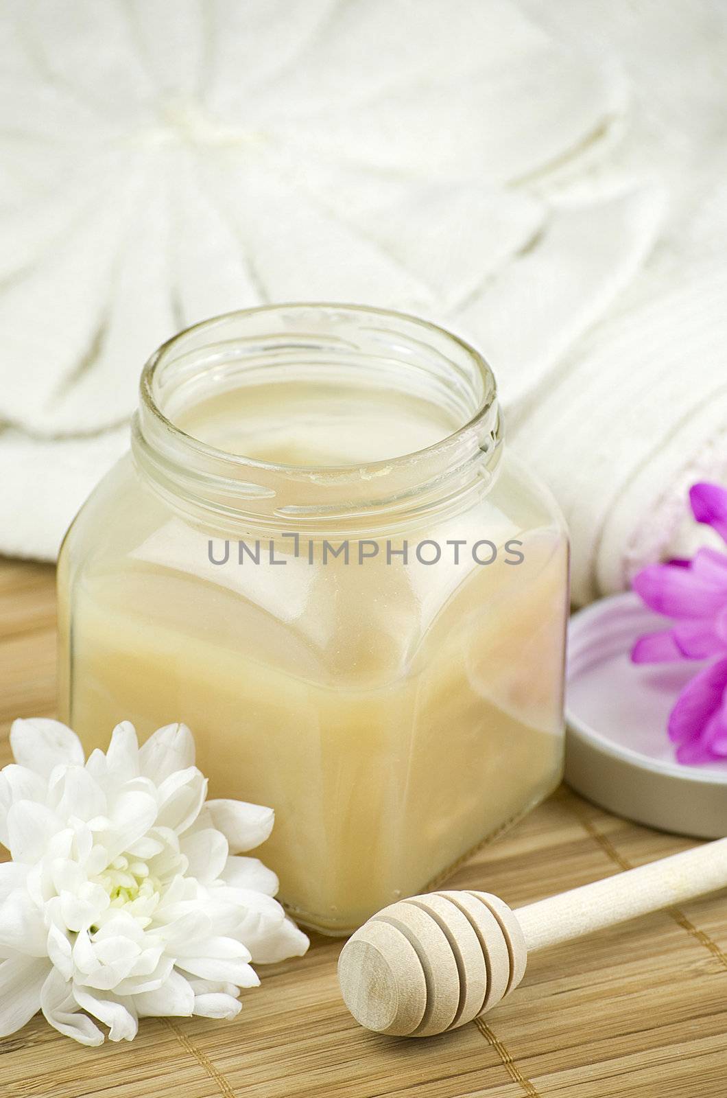 relaxing aroma of almond coconut vanilla milk and honey bath foam over wooden mat