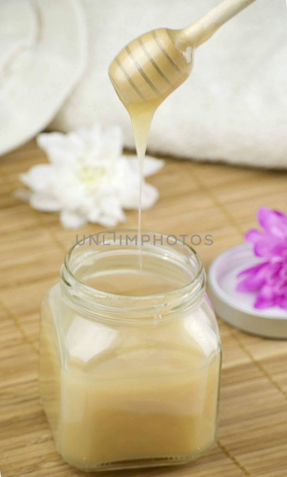 relaxing aroma of almond coconut vanilla milk and honey bath foam over wooden mat