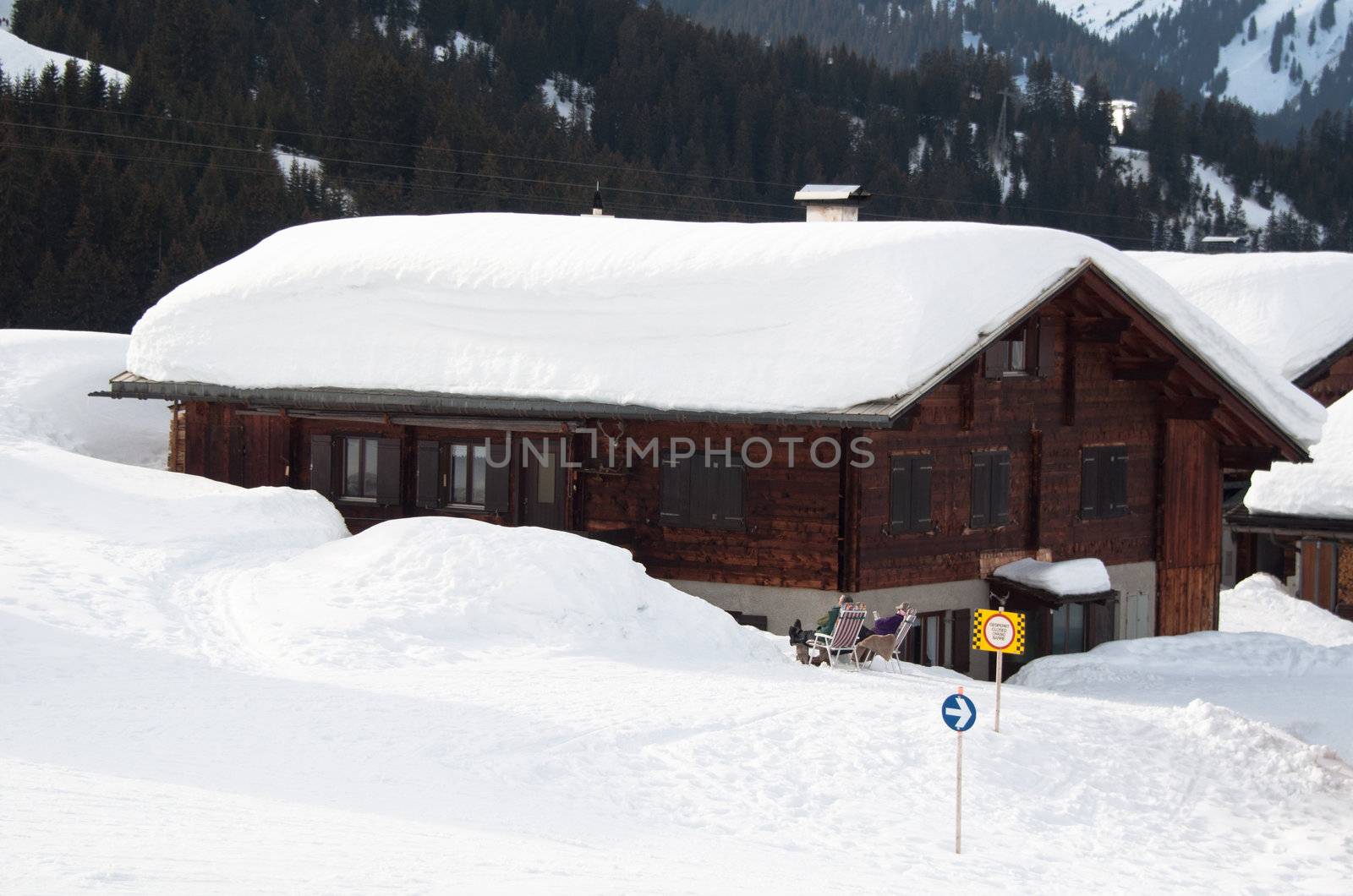 Small wooden huts covered with a lot of fresh snow in Montafon, Austria