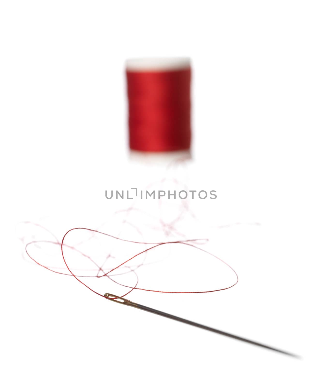 Thread Reel and nedle on white background