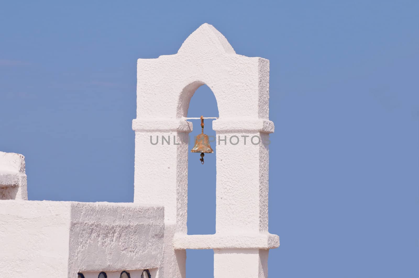 Typical byzantine greek church bell on blue sky