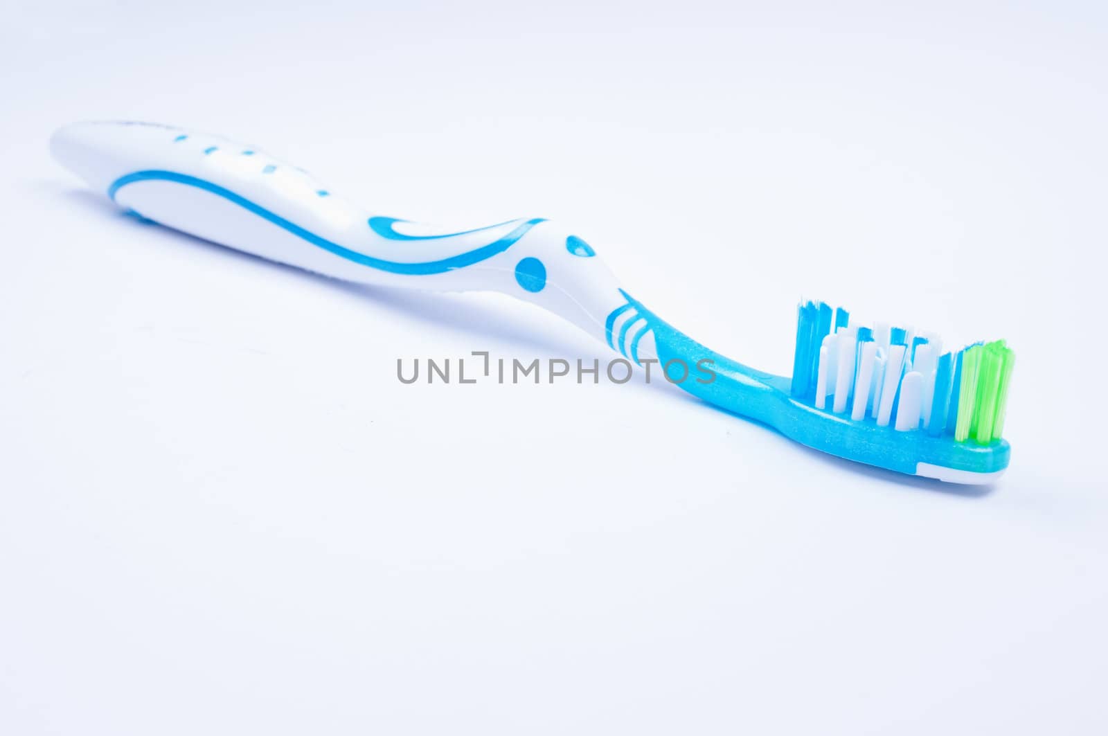 A toothbrush on white background close up