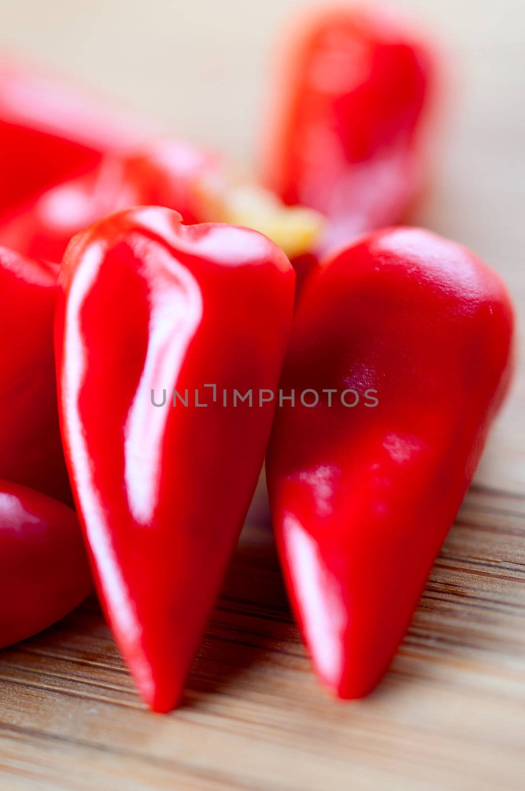 Canned chili pepper on a cutting board close up by Nanisimova