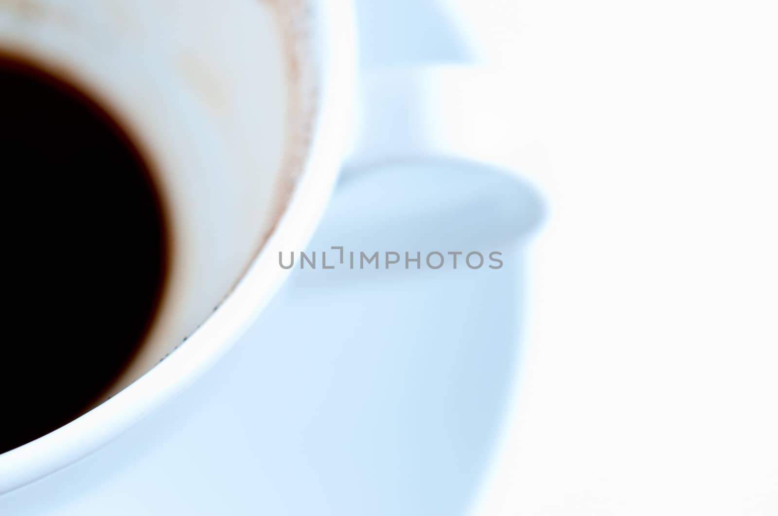 Drunk coffee cup and saucer on white background close up