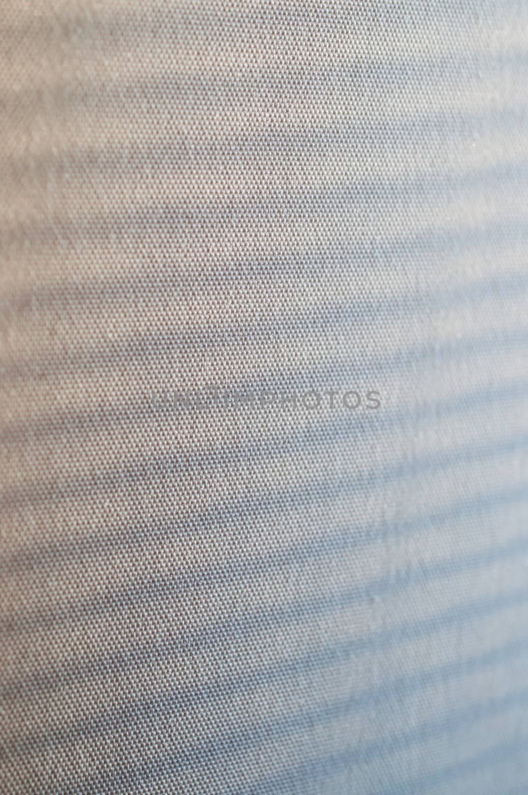 fragment of a beige fabric with shadow close up