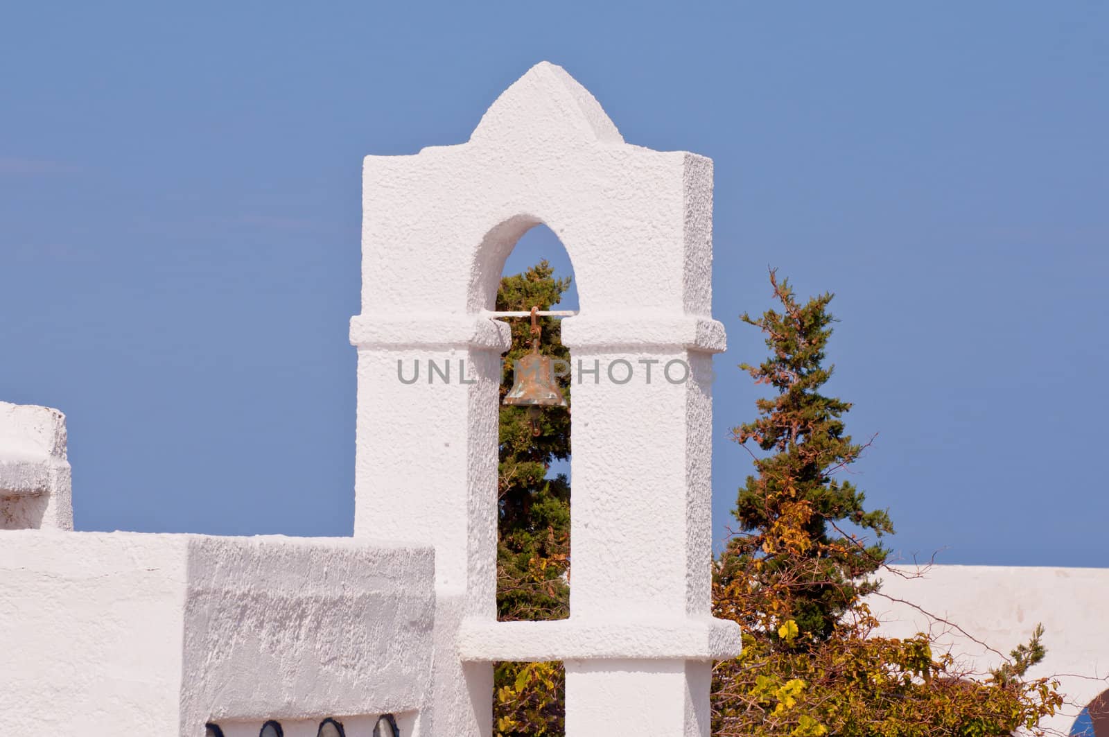 Typical byzantine greek church bell on blue sky by Nanisimova