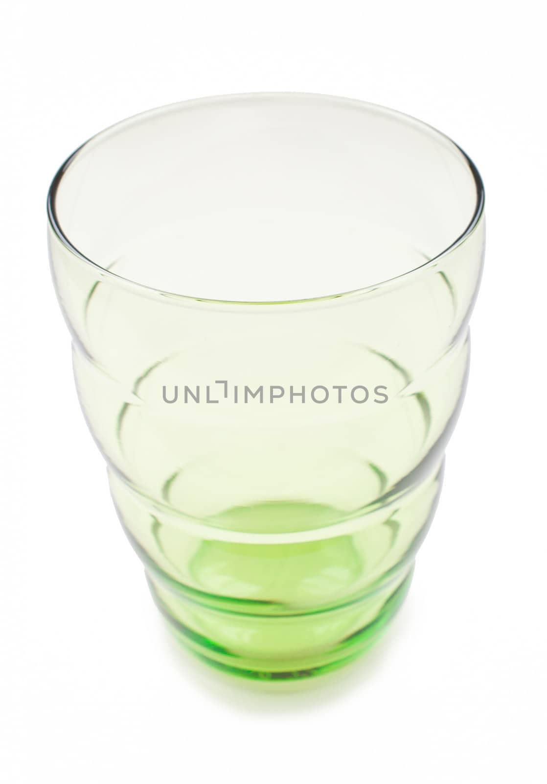 Green glass cup on white background