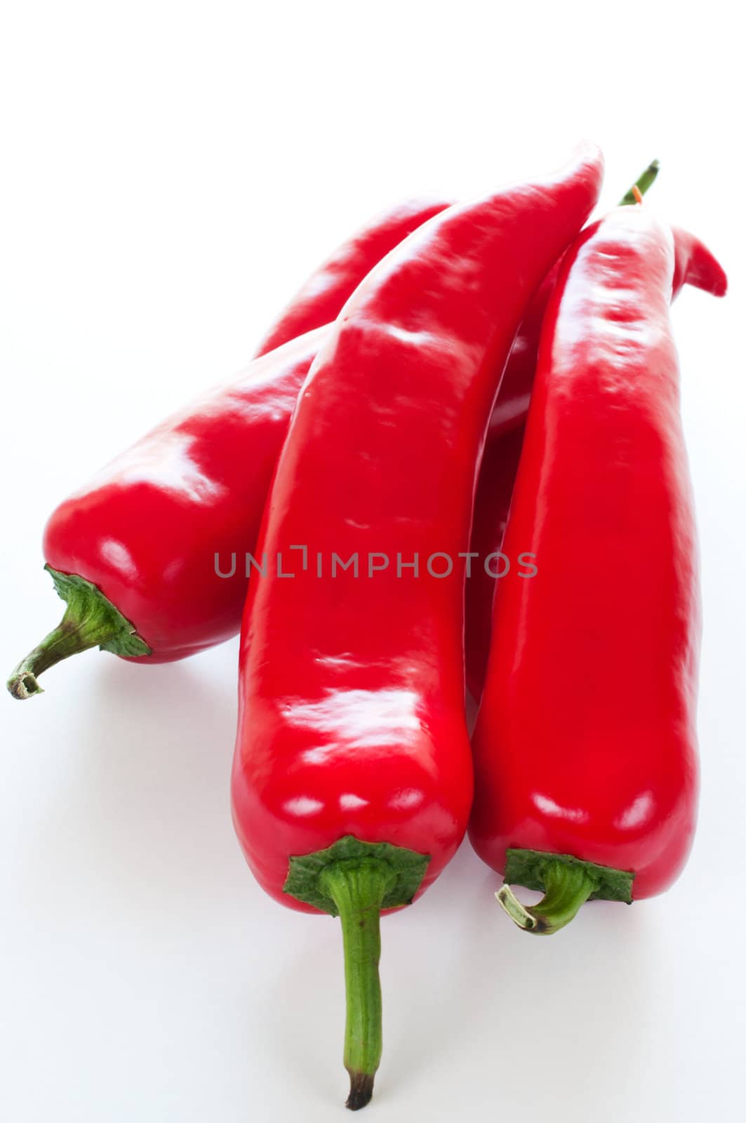 Bundle paprika peppers on white background close up