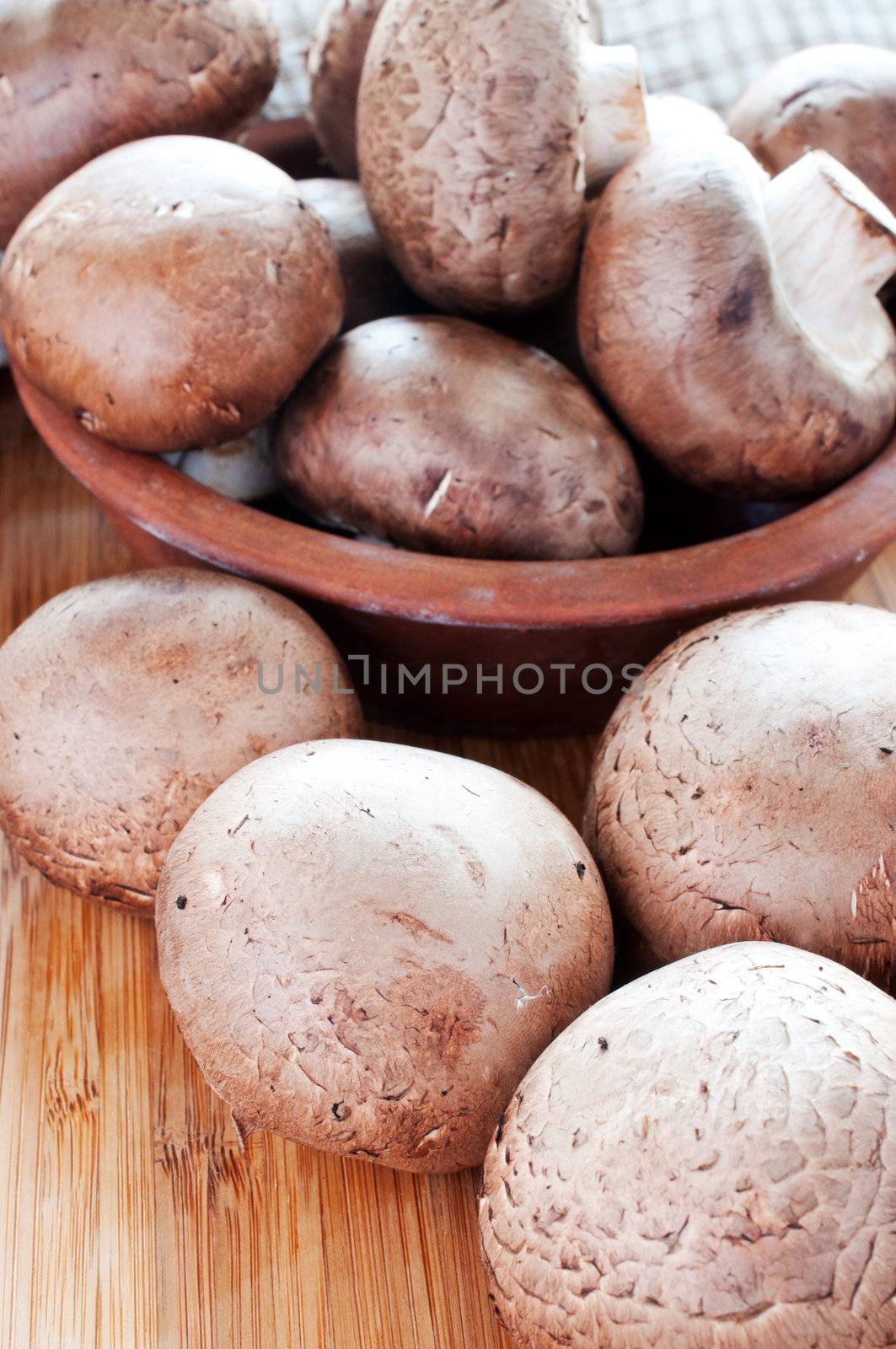 Raw mushrooms on cutting board