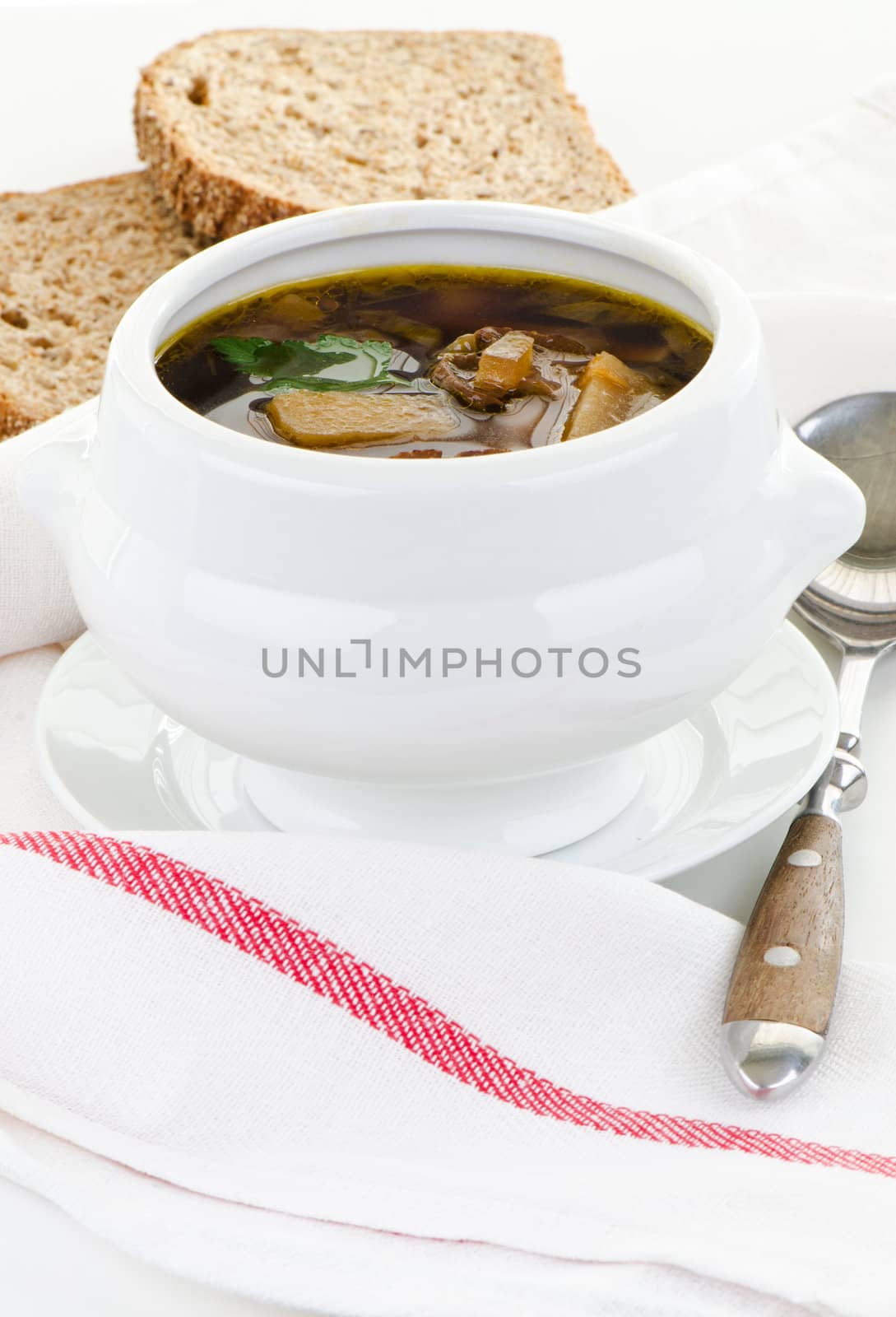 Bowl of mushroom soup on a cloth by Nanisimova