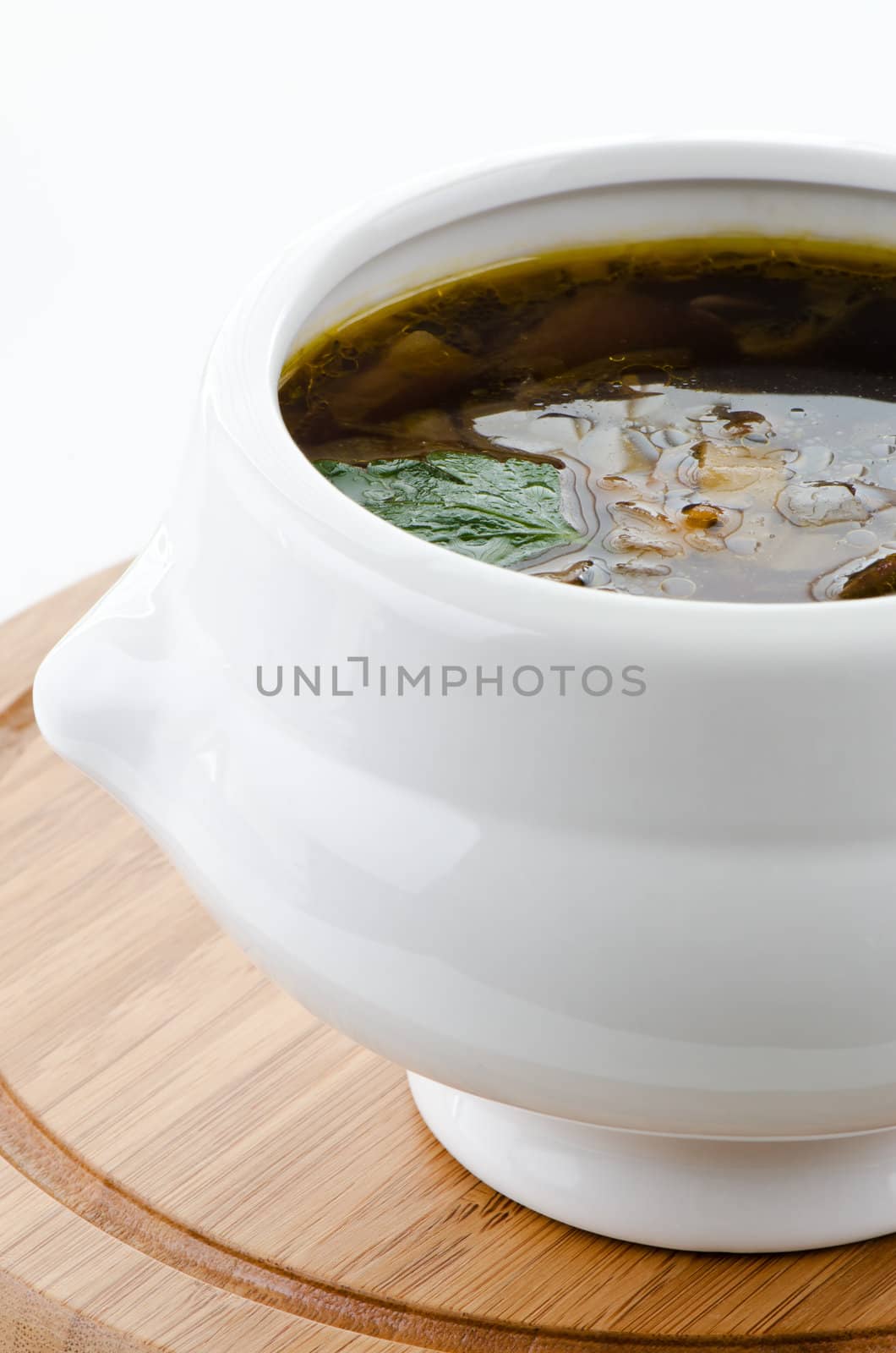 Bowl of mushroom soup detail by Nanisimova