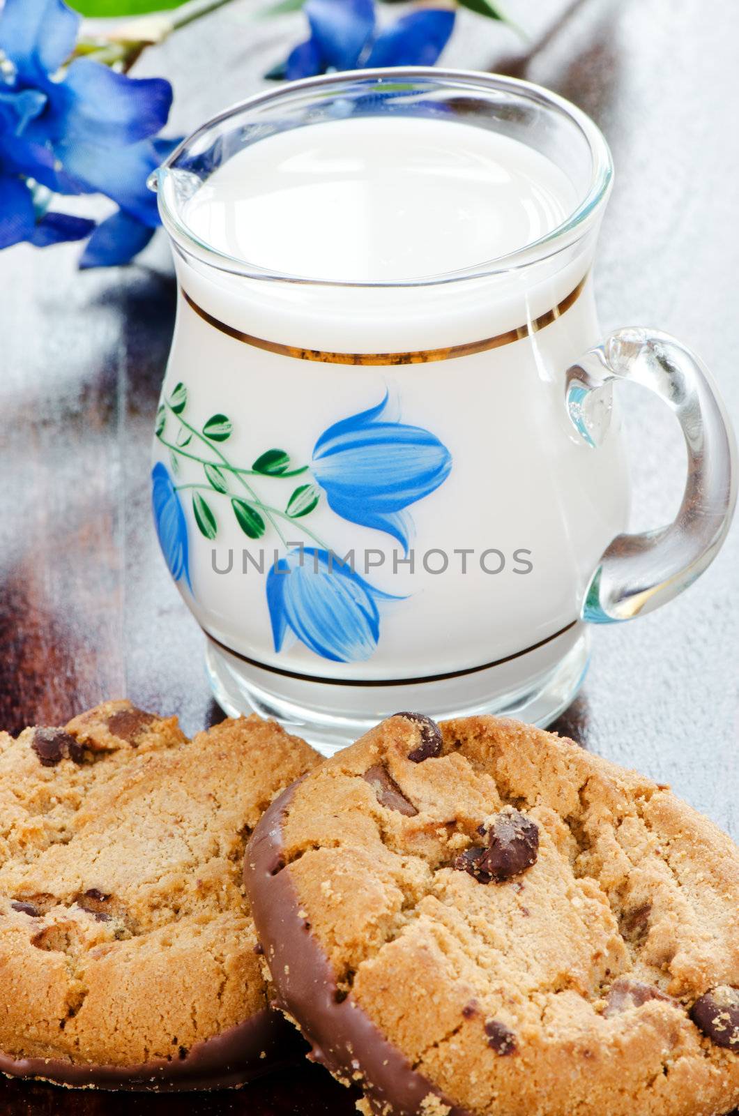 Two chocolate cookies and milk  by Nanisimova