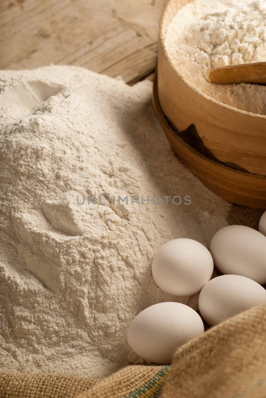 Baking table full of ingredients with side light