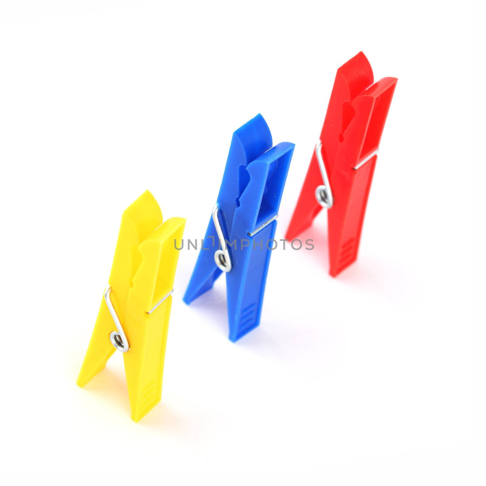 colored clothespins isolated on white background