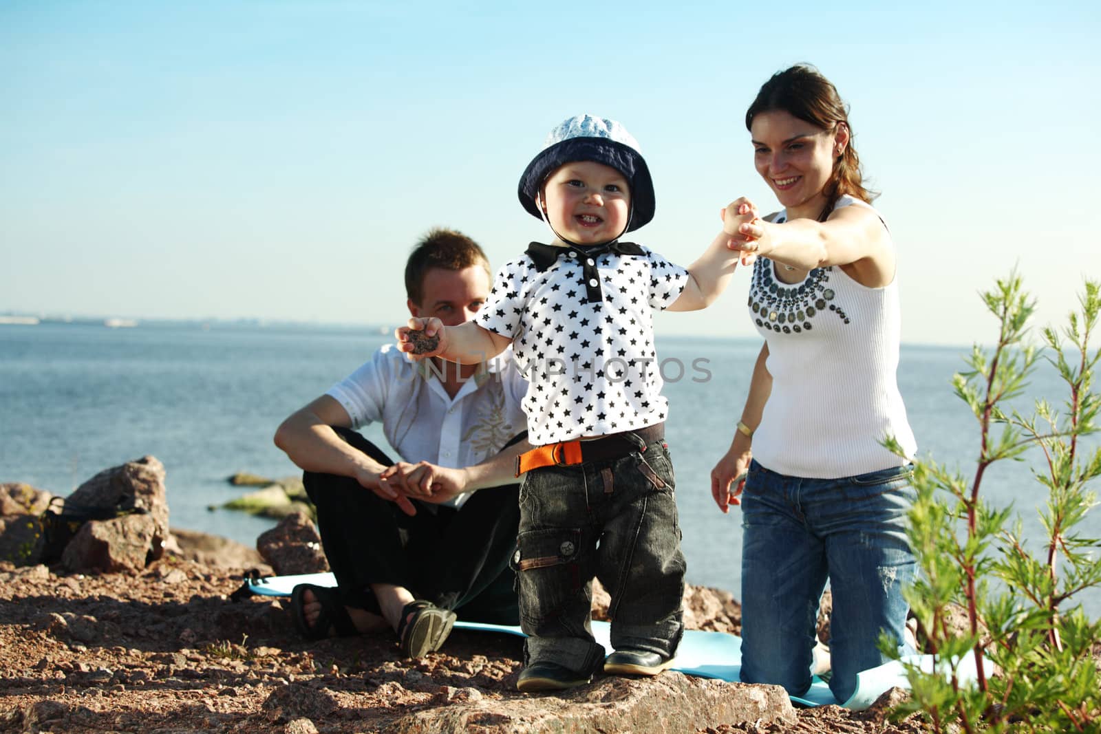 picnic of happy family near sea