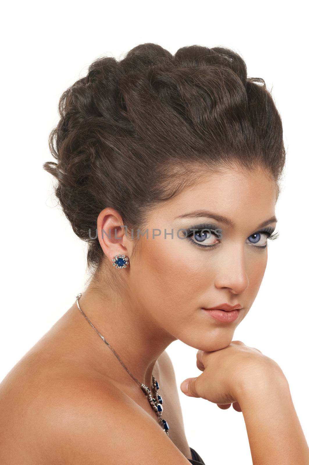 Young woman with beautiful make up, hairdo and sapphire  diamond jewelry