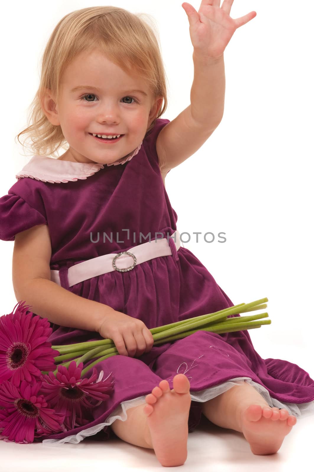 A very cute toddler with flowers