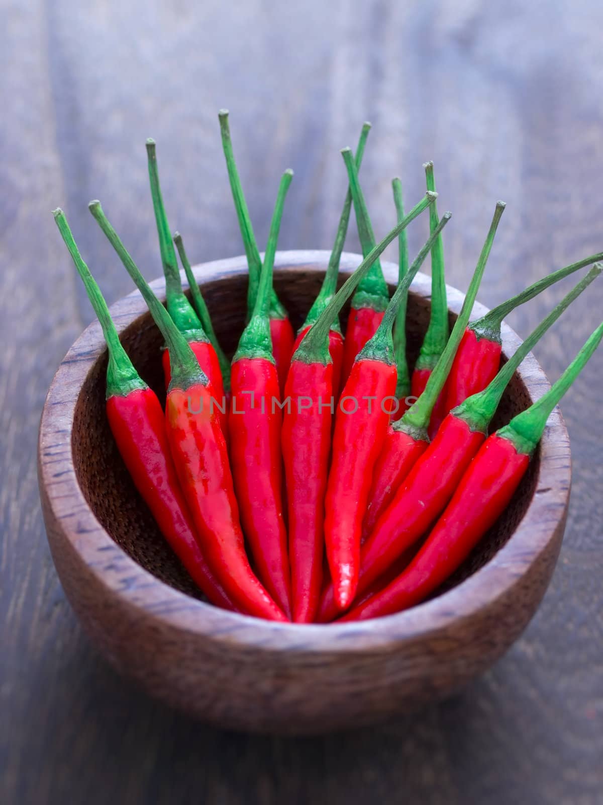 close up of a bowl of red chili padi