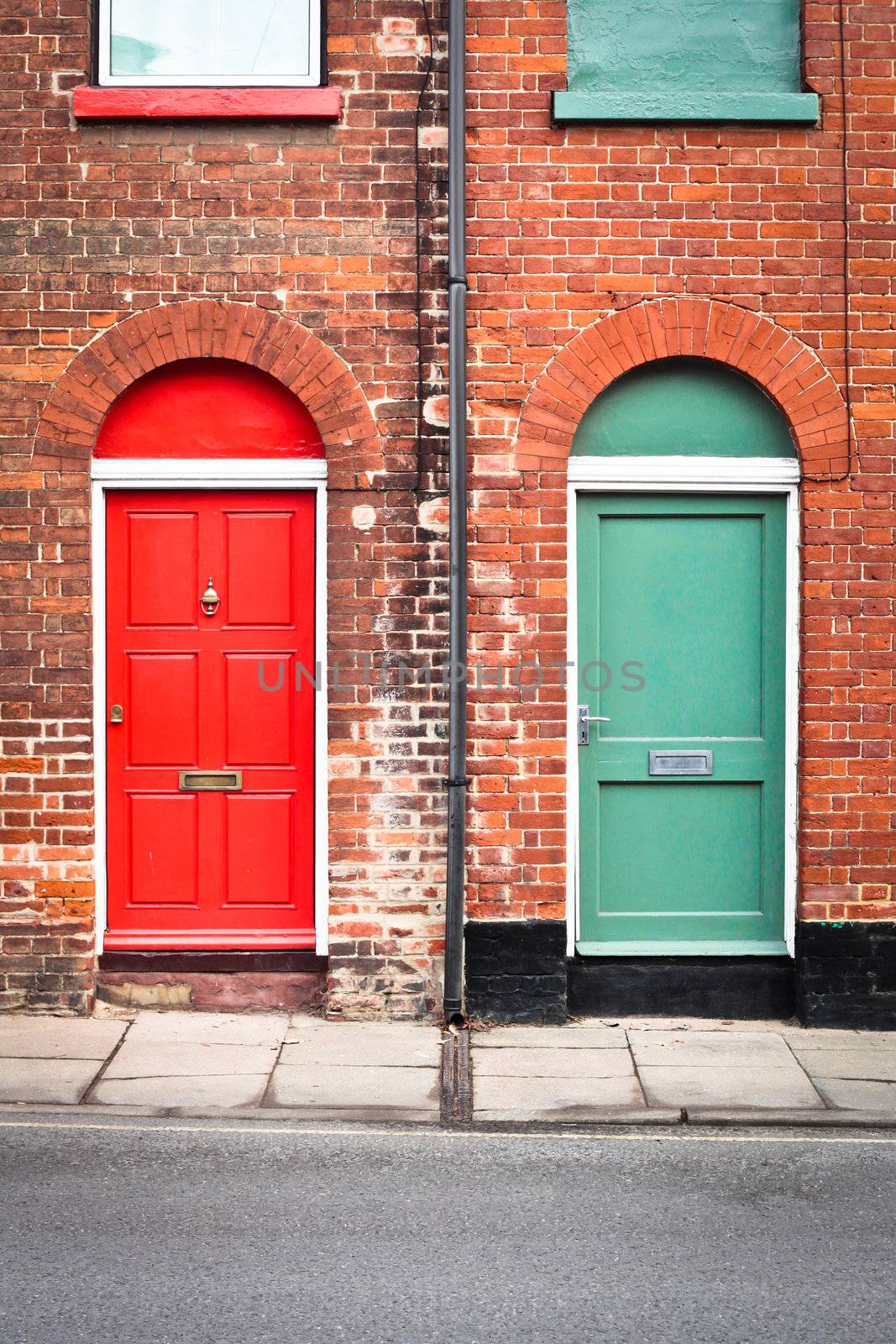 Colorful front doors of two adjoining town houses in England